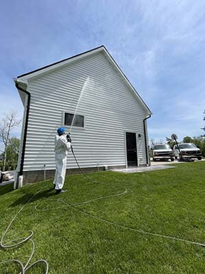 Professional pressure washing on an exterior surface